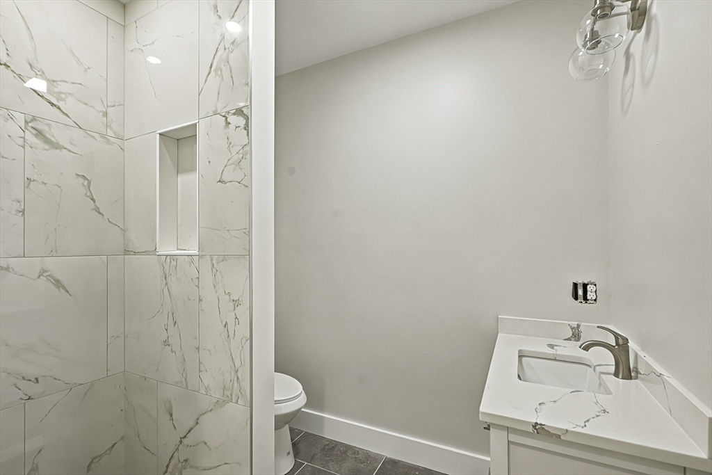 4 Mayhew Street Framingham, MA 01702 - Photo 31 of 42 a bathroom with a sink toilet and shower