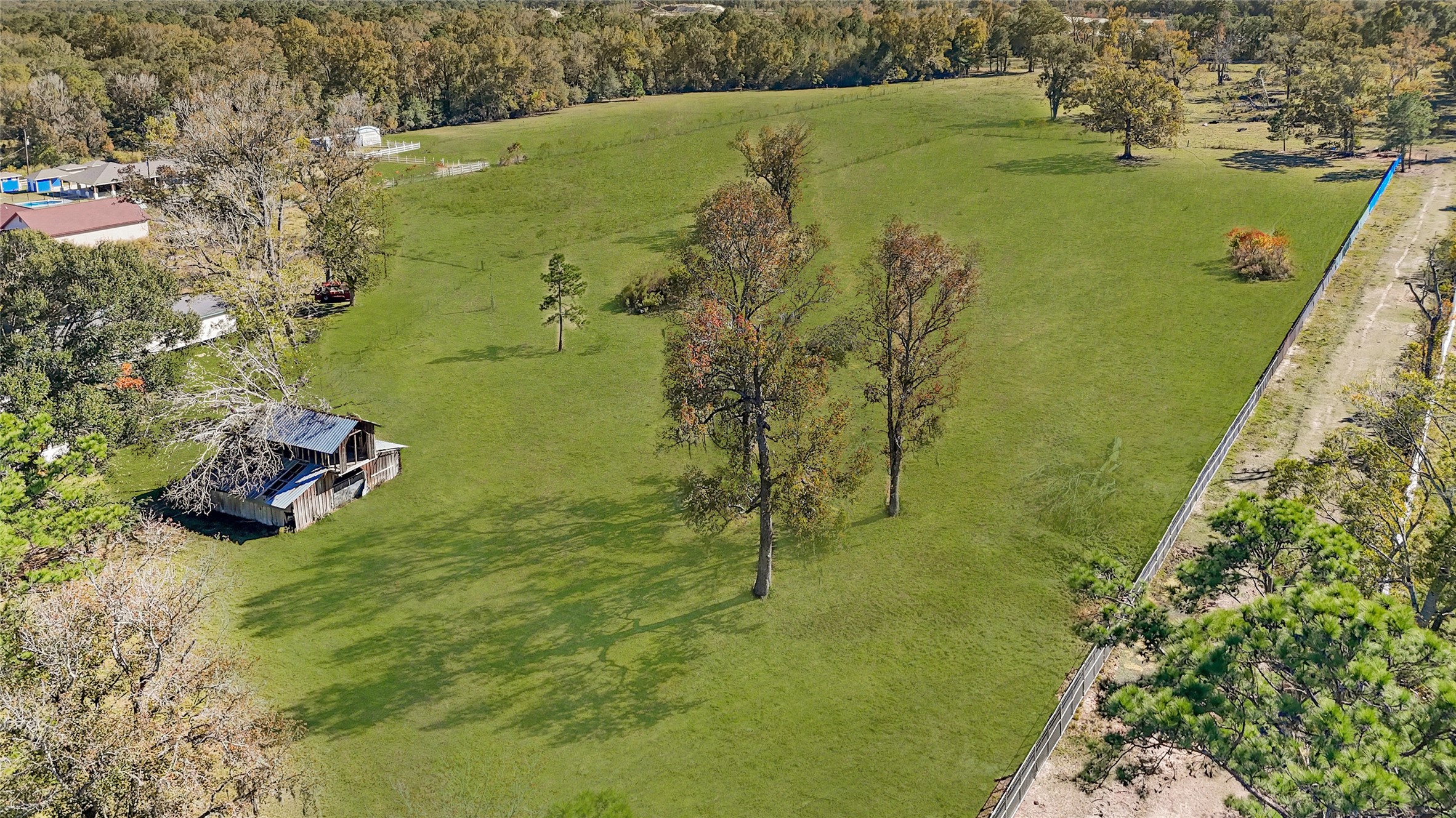 1244 County Road 332 Cleveland, TX 77327 - Photo 6 of 10 a view of a lake with a yard