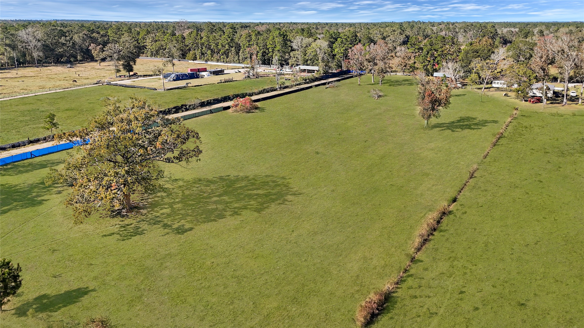 1244 County Road 332 Cleveland, TX 77327 - Photo 8 of 10 a view of a lake with a houses