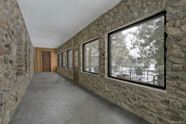 a view of a room with large windows