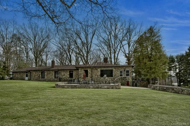 a front view of house with yard and seating area