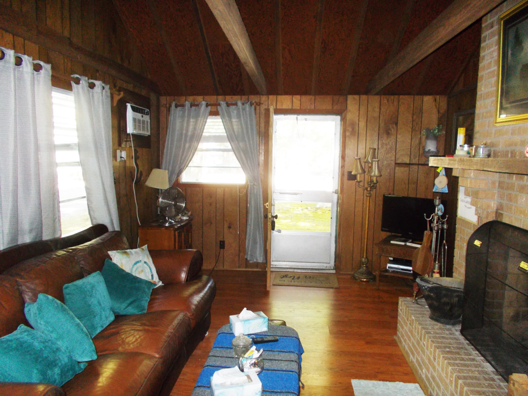 332 Mockingbird Hill Road Eva, TN 38333 - Photo 12 of 27 a living room with furniture and a fireplace