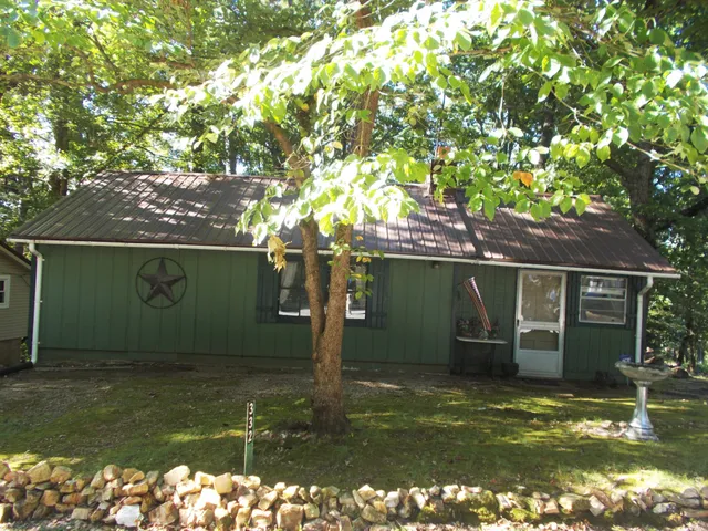 a view of a house with a tree
