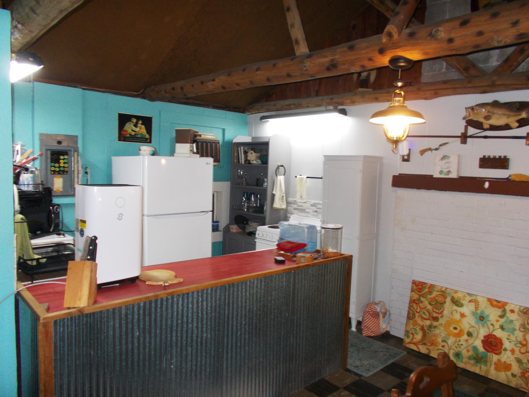 332 Mockingbird Hill Road Eva, TN 38333 - Photo 5 of 27 a kitchen with refrigerator and cabinets