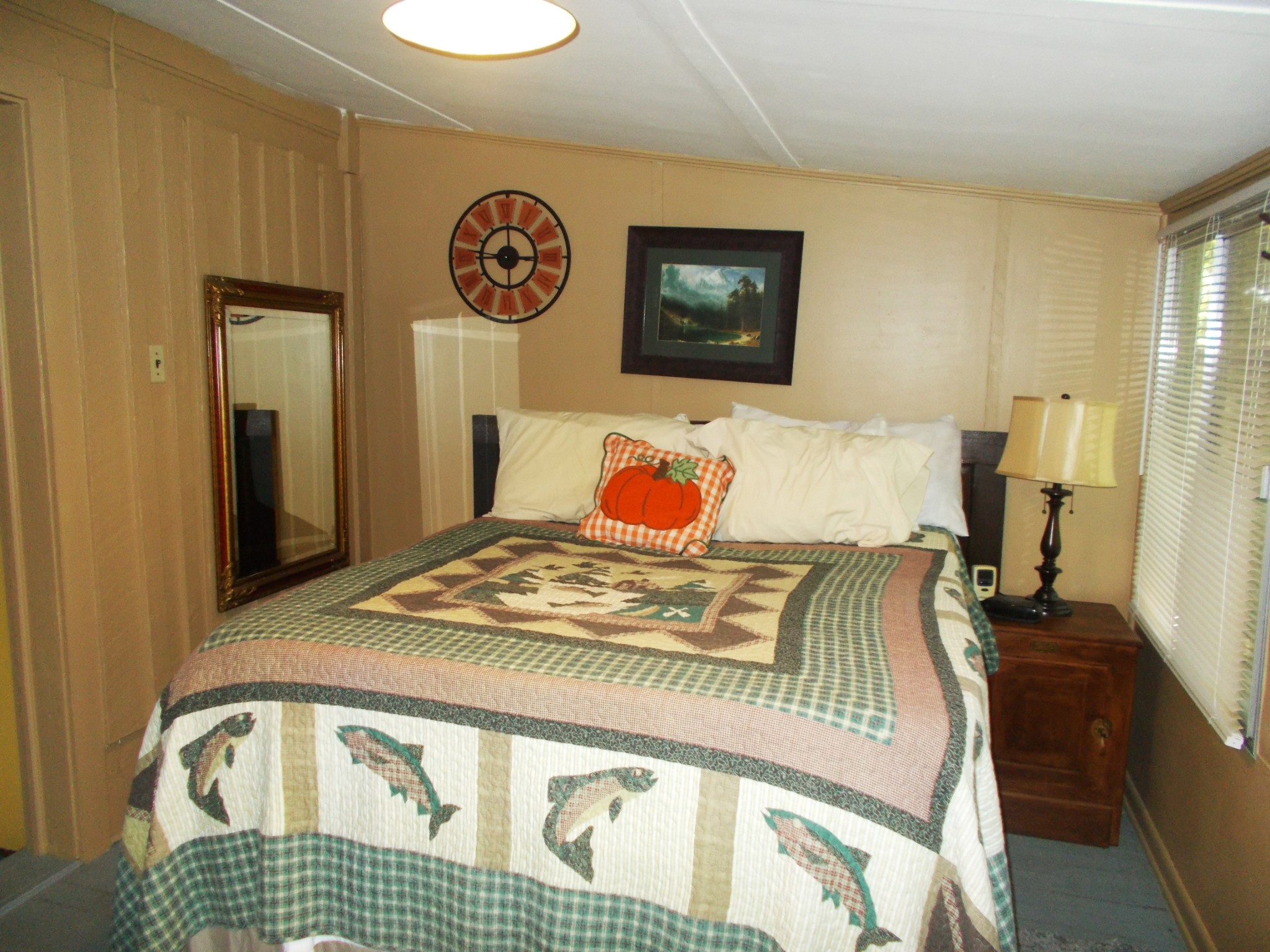 332 Mockingbird Hill Road Eva, TN 38333 - Photo 10 of 27 a bedroom with a bed and wooden floor