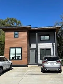 a view of a car parked in front of a house