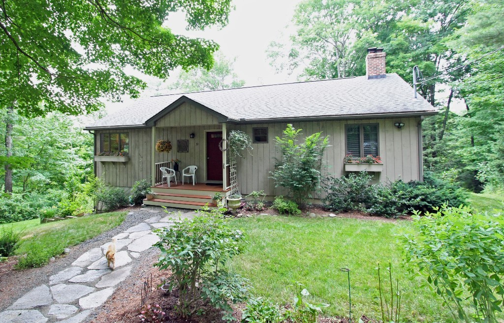 39 Harlow Clark Road Huntington, MA 01050 - Photo 1 of 30 a house view with a garden space