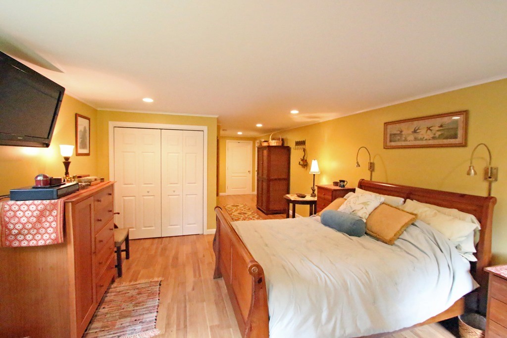 39 Harlow Clark Road Huntington, MA 01050 - Photo 17 of 30 a bedroom with a bed and a flat screen tv