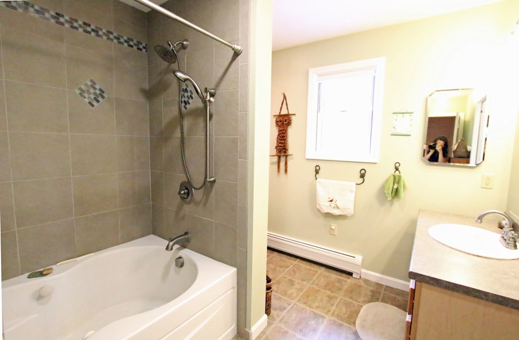 39 Harlow Clark Road Huntington, MA 01050 - Photo 18 of 30 a bathroom with a tub sink and mirror