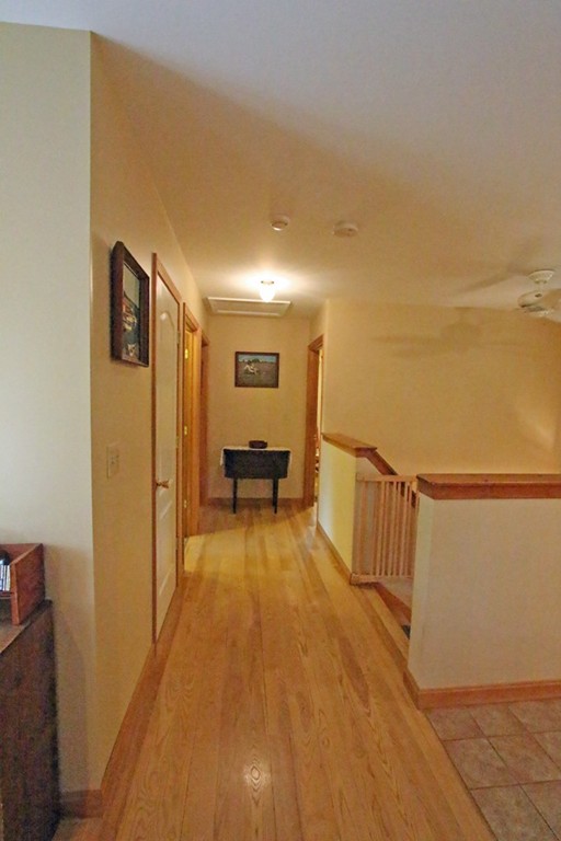 39 Harlow Clark Road Huntington, MA 01050 - Photo 22 of 30 a view of a hallway with wooden floor and staircase