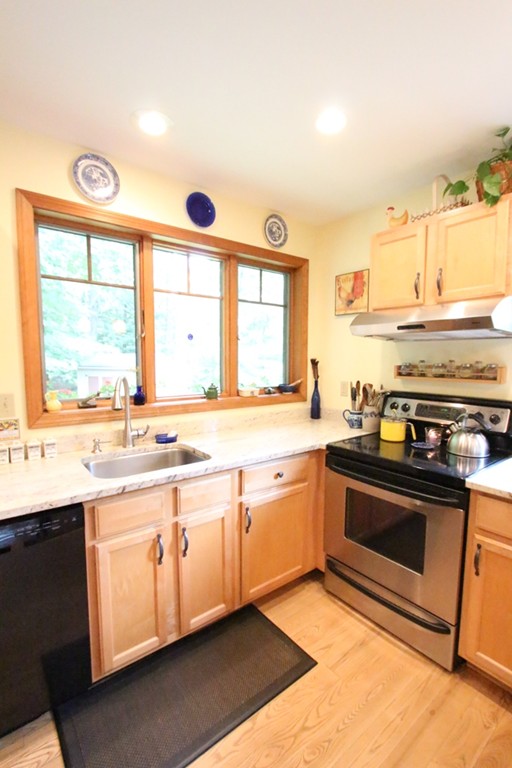39 Harlow Clark Road Huntington, MA 01050 - Photo 8 of 30 a large kitchen with stainless steel appliances granite countertop a stove and a sink