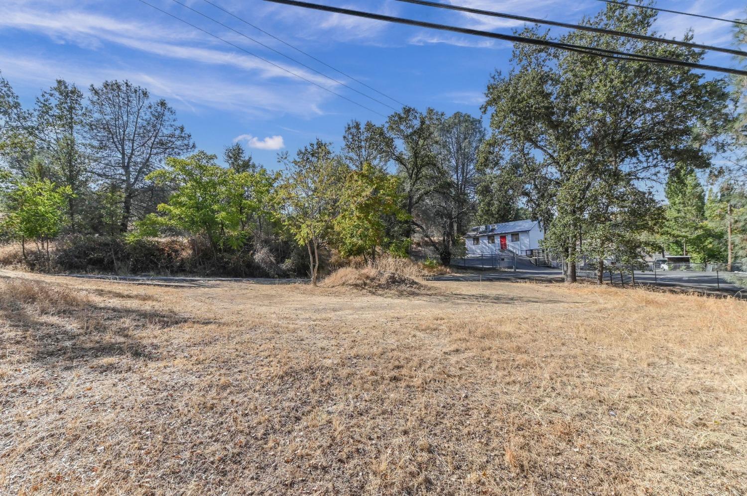 0 Raspberry Lane Angels Camp, CA 95222 - Photo 31 of 46 a wooden bench sitting in front of a building