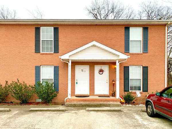 a front view of a house with yard