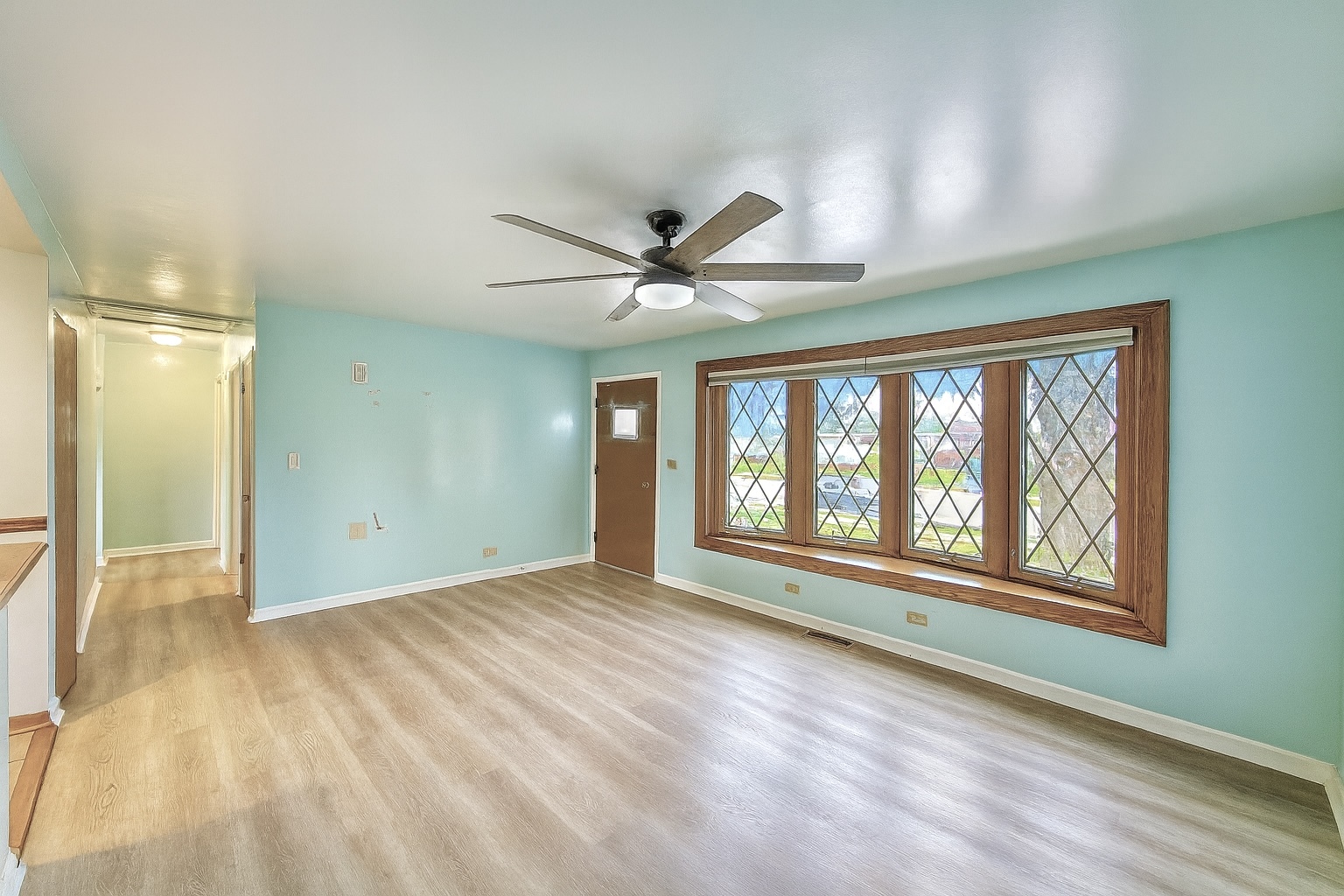 539 Rose Avenue Addison, IL 60101 - Photo 2 of 15 a view of an empty room with a window