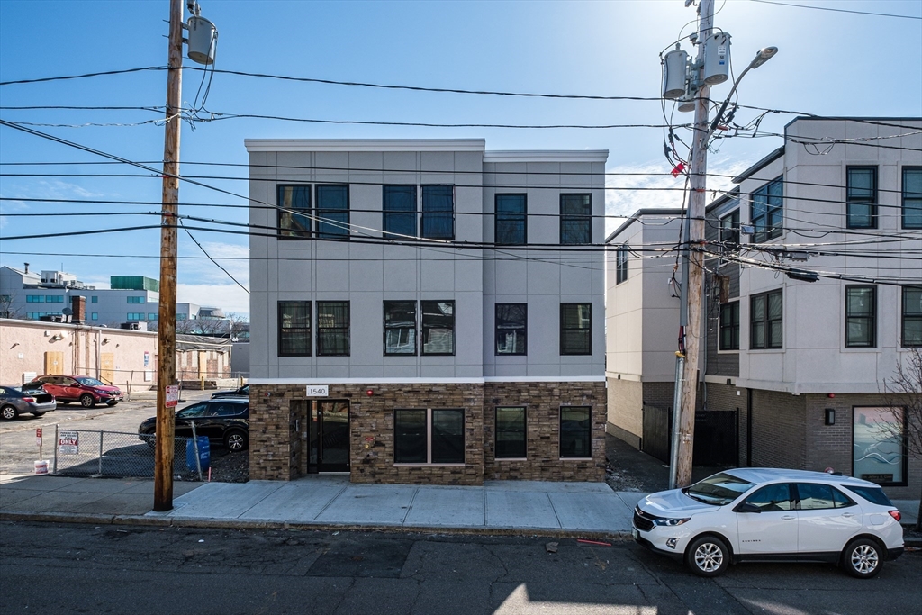 1540 North Shore Road, Unit 102 Revere, MA 02151 - Photo 13 of 14 a car parked in front of a building