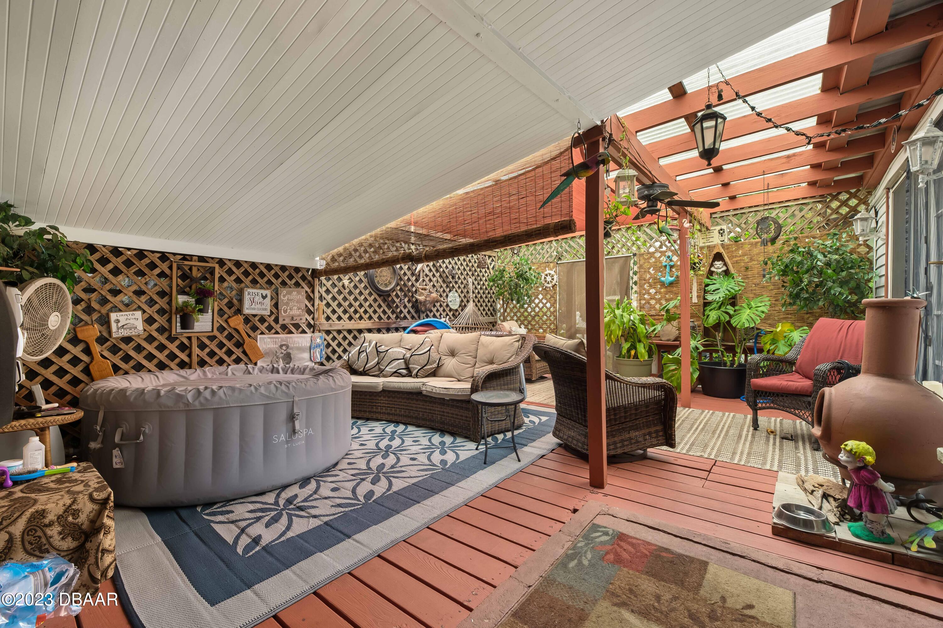 a outdoor living space with patio furniture and a potted plant