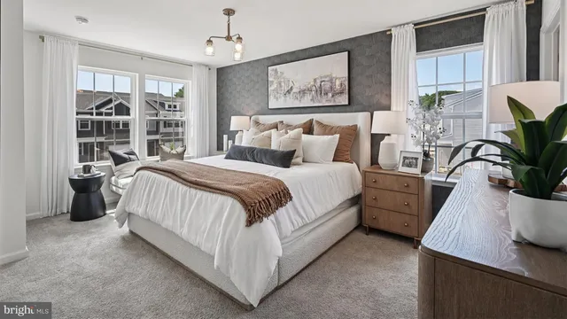 a bedroom with bed and a chandelier