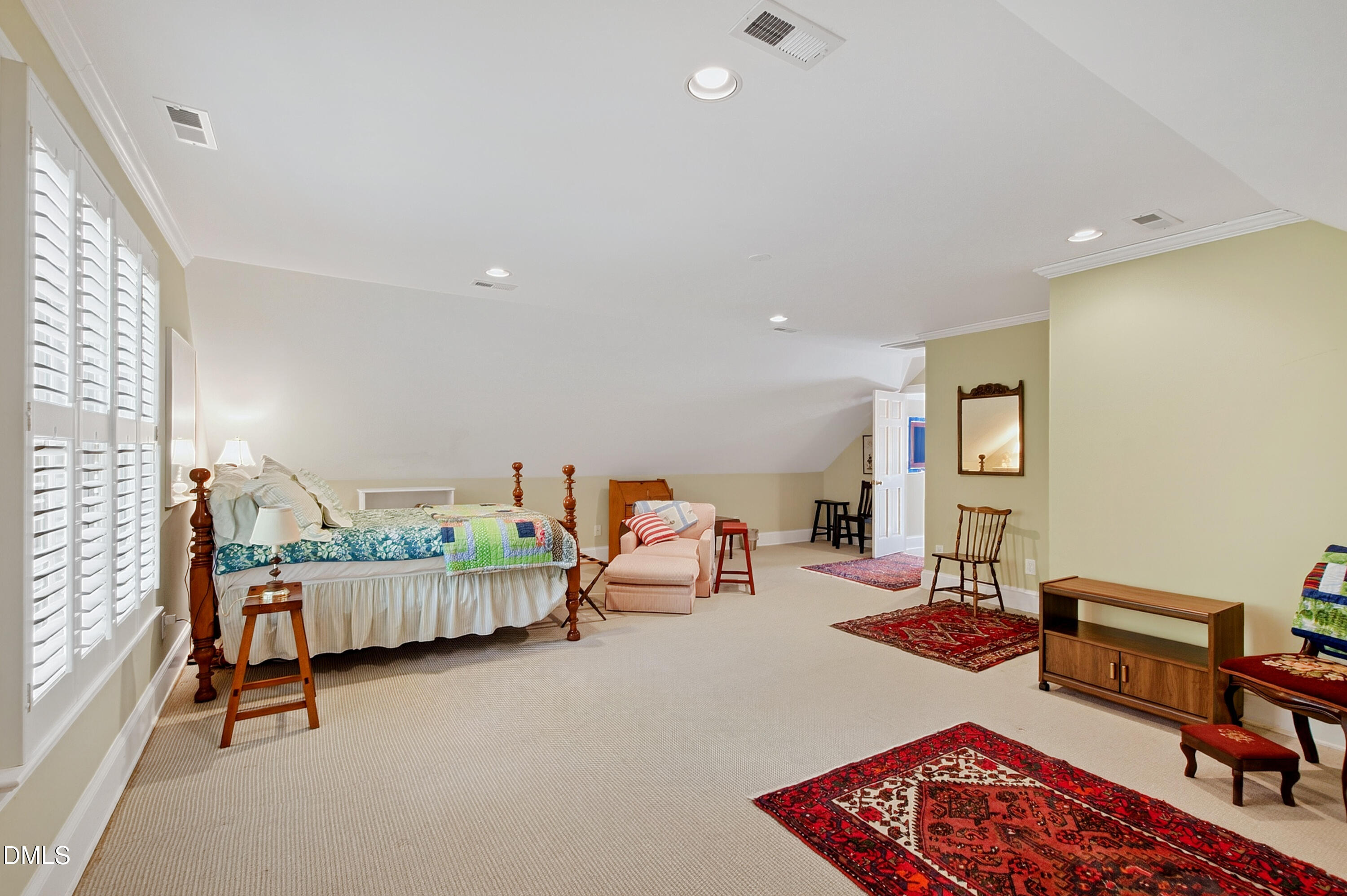3708 Lubbock Drive Raleigh, NC 27612 - Photo 53 of 64 a bedroom with furniture and a wooden floor