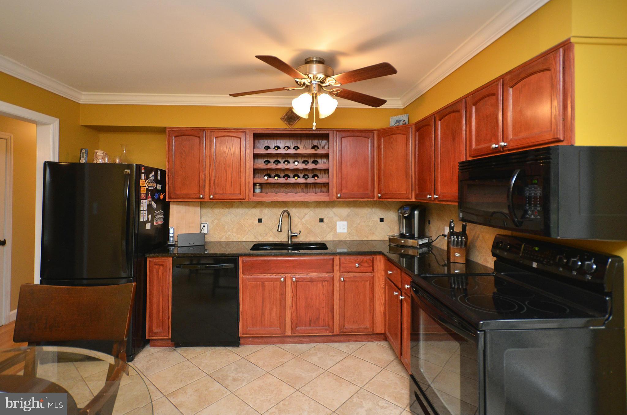 20952 Evergreen Mills Road Leesburg, VA 20175 - Photo 2 of 30 a kitchen with stainless steel appliances granite countertop a sink stove and refrigerator