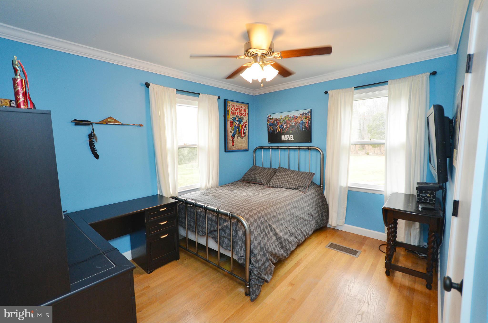 20952 Evergreen Mills Road Leesburg, VA 20175 - Photo 13 of 30 a bedroom with a bed dresser and a window
