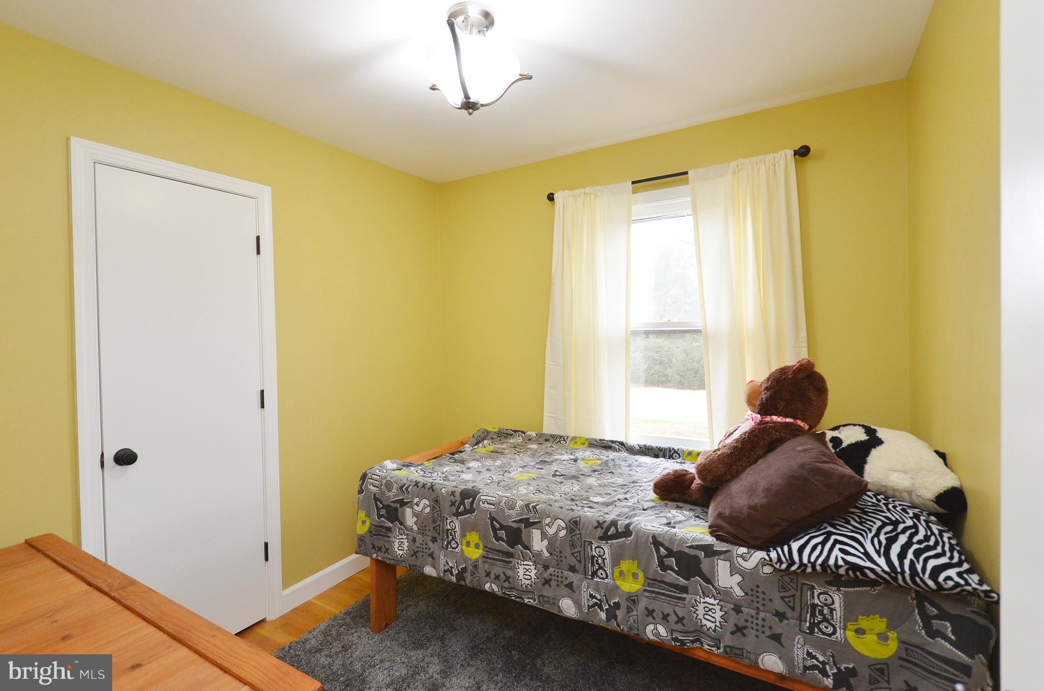 20952 Evergreen Mills Road Leesburg, VA 20175 - Photo 14 of 30 a bedroom with a bed and a window