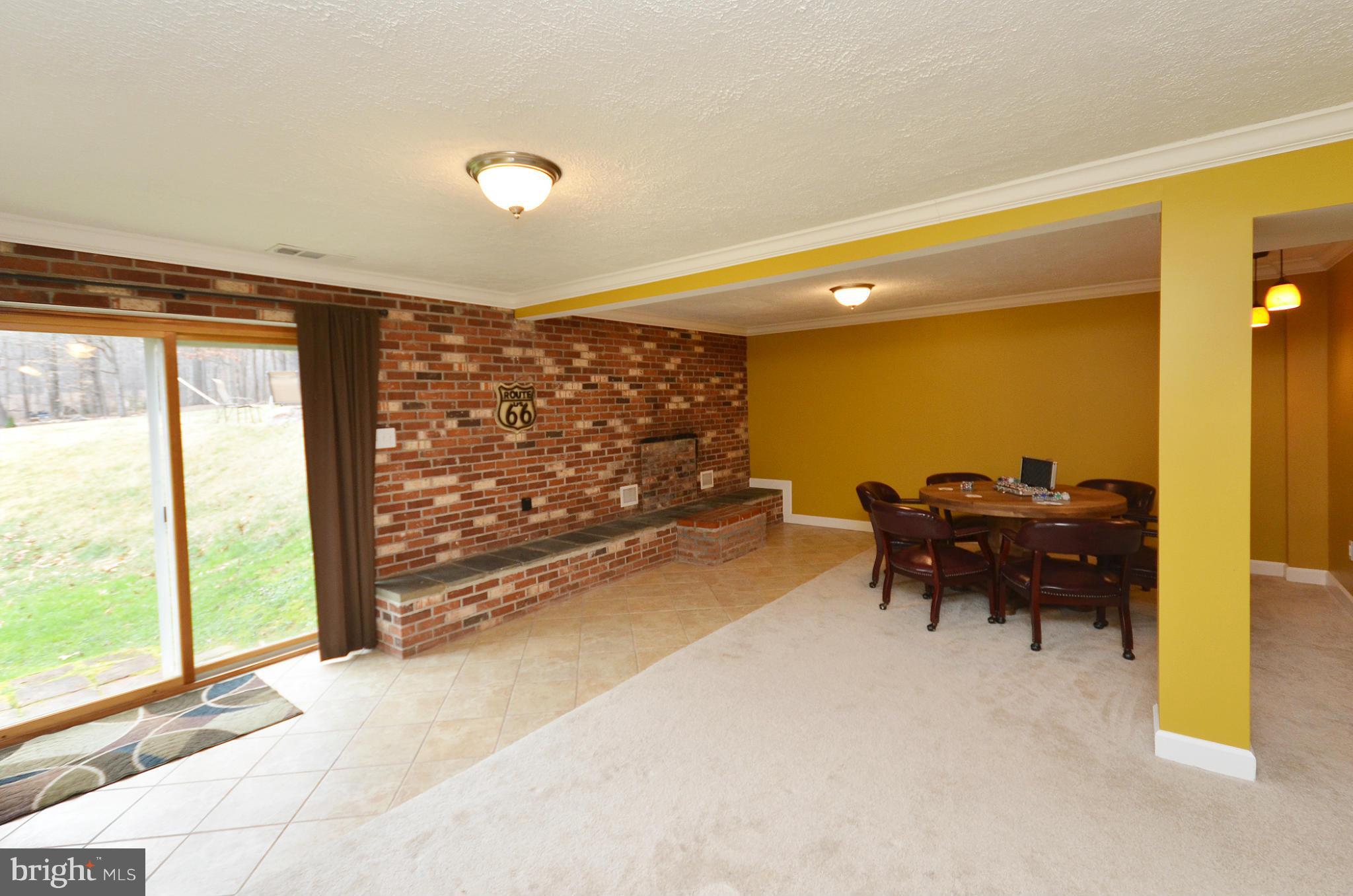 20952 Evergreen Mills Road Leesburg, VA 20175 - Photo 16 of 30 a view of a workspace with furniture and a window