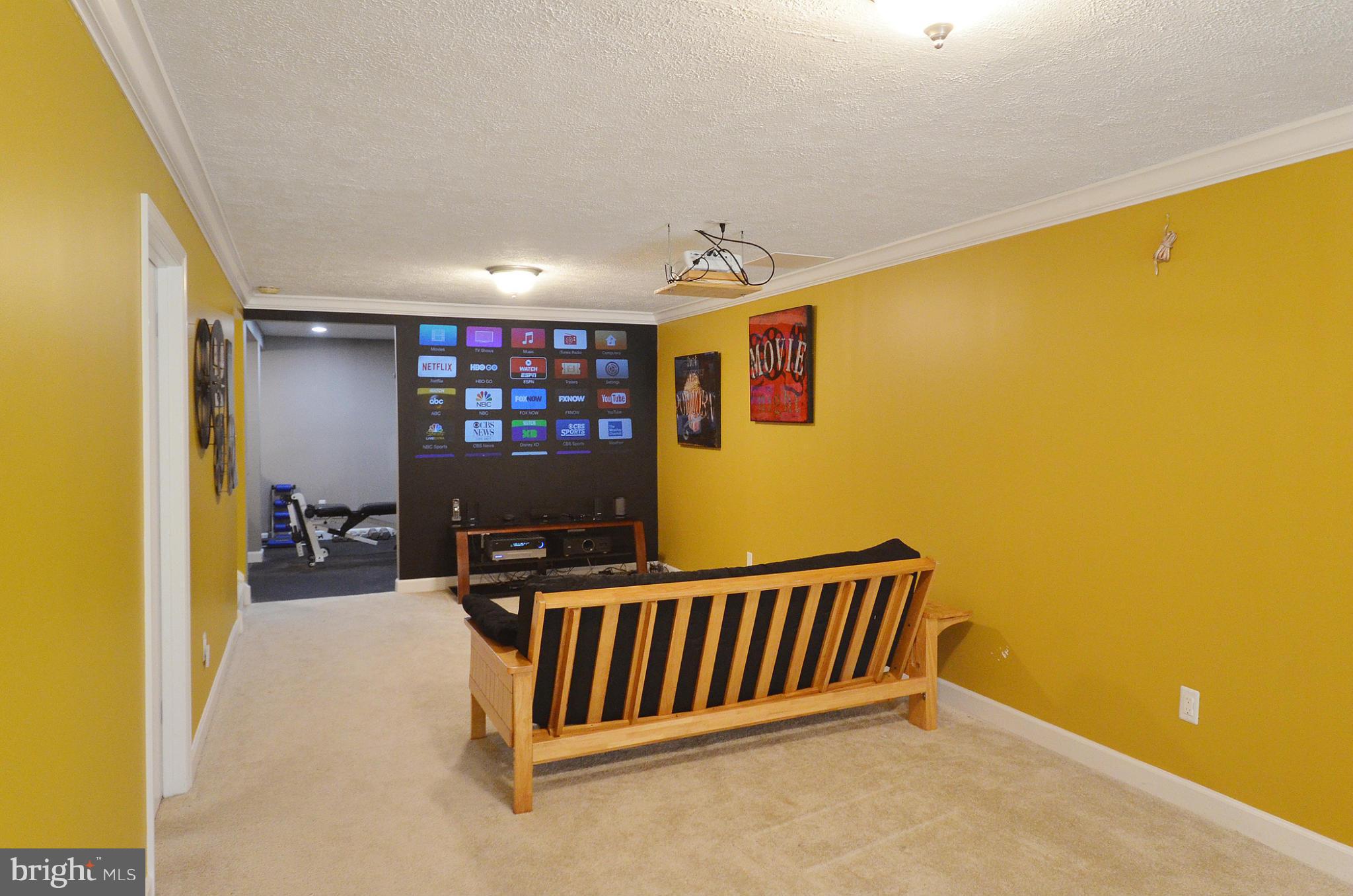 20952 Evergreen Mills Road Leesburg, VA 20175 - Photo 17 of 30 a view of a hallway with a large window and a projector screen