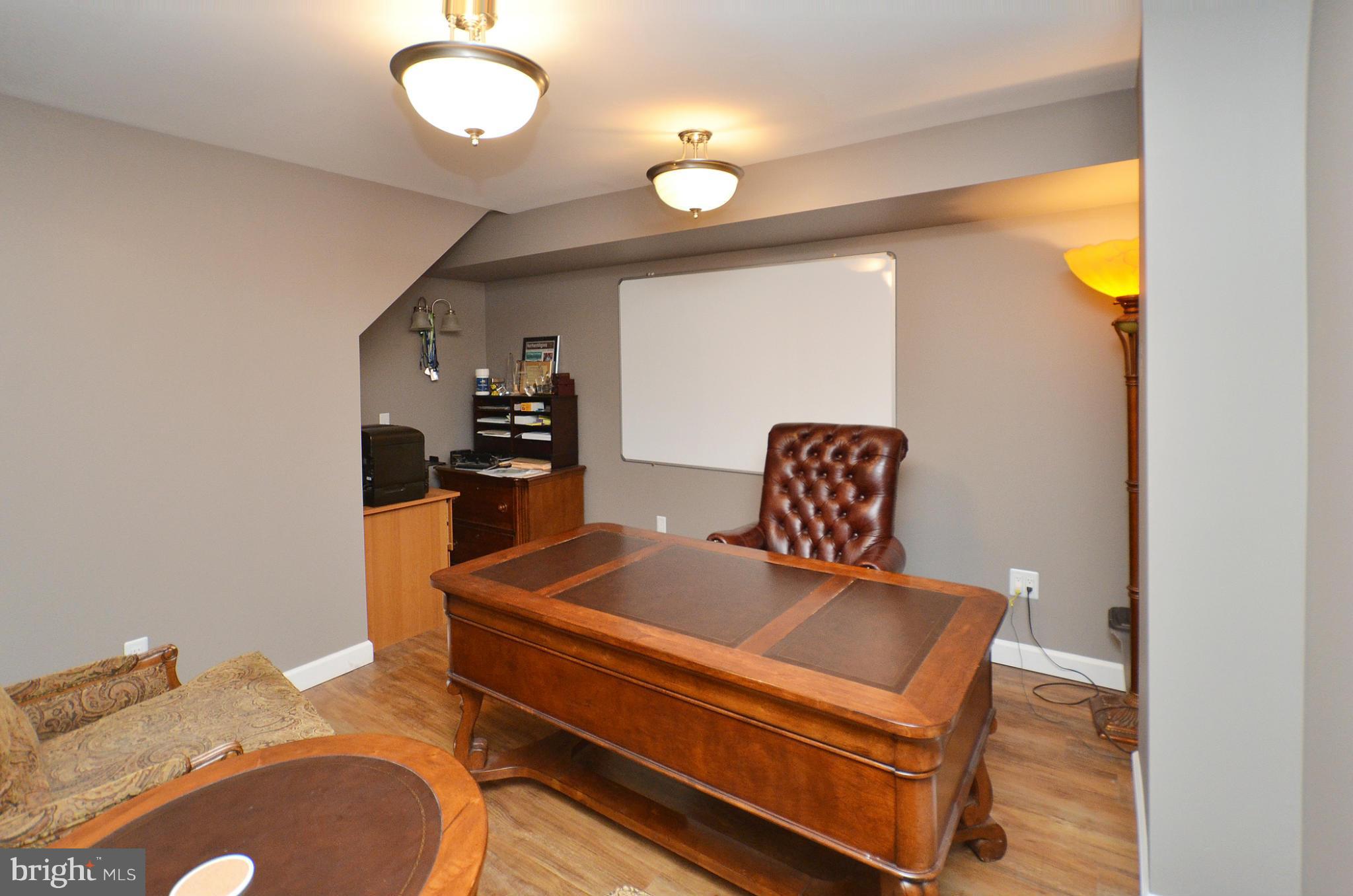 20952 Evergreen Mills Road Leesburg, VA 20175 - Photo 20 of 30 a room with furniture and wooden floor