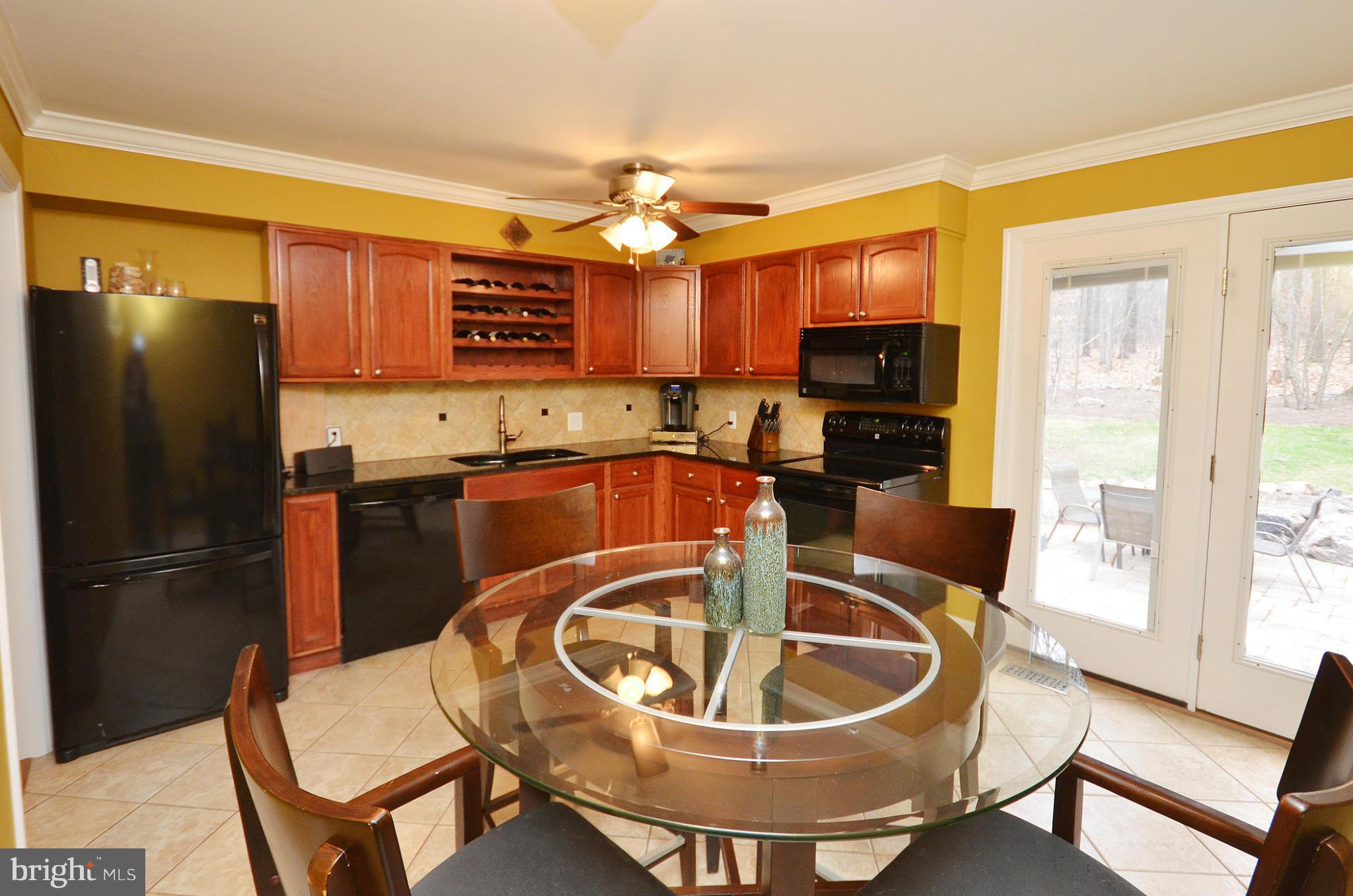 20952 Evergreen Mills Road Leesburg, VA 20175 - Photo 3 of 30 a kitchen with a refrigerator a sink and a refrigerator