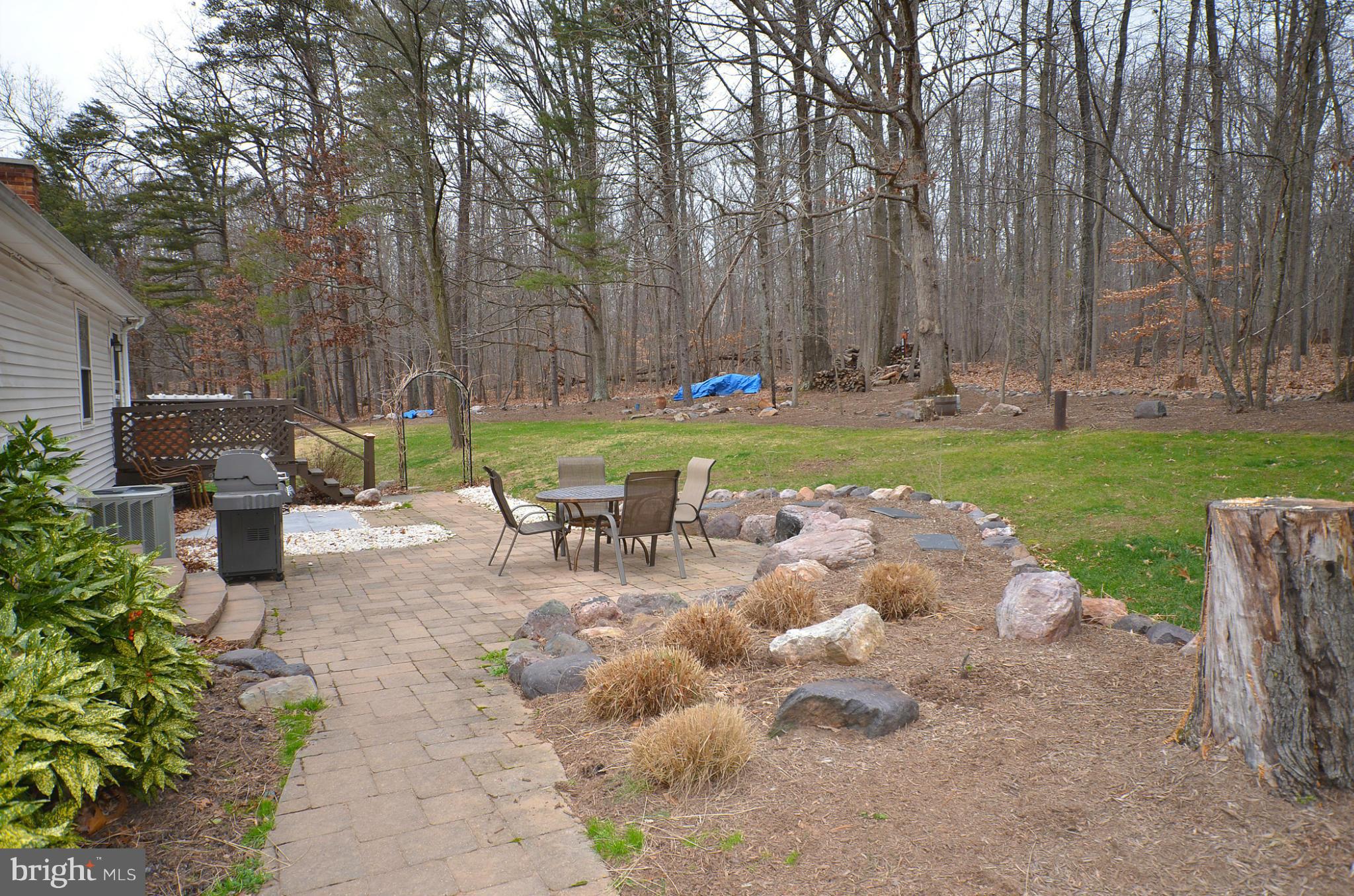 20952 Evergreen Mills Road Leesburg, VA 20175 - Photo 22 of 30 a view of backyard with outdoor seating and green space
