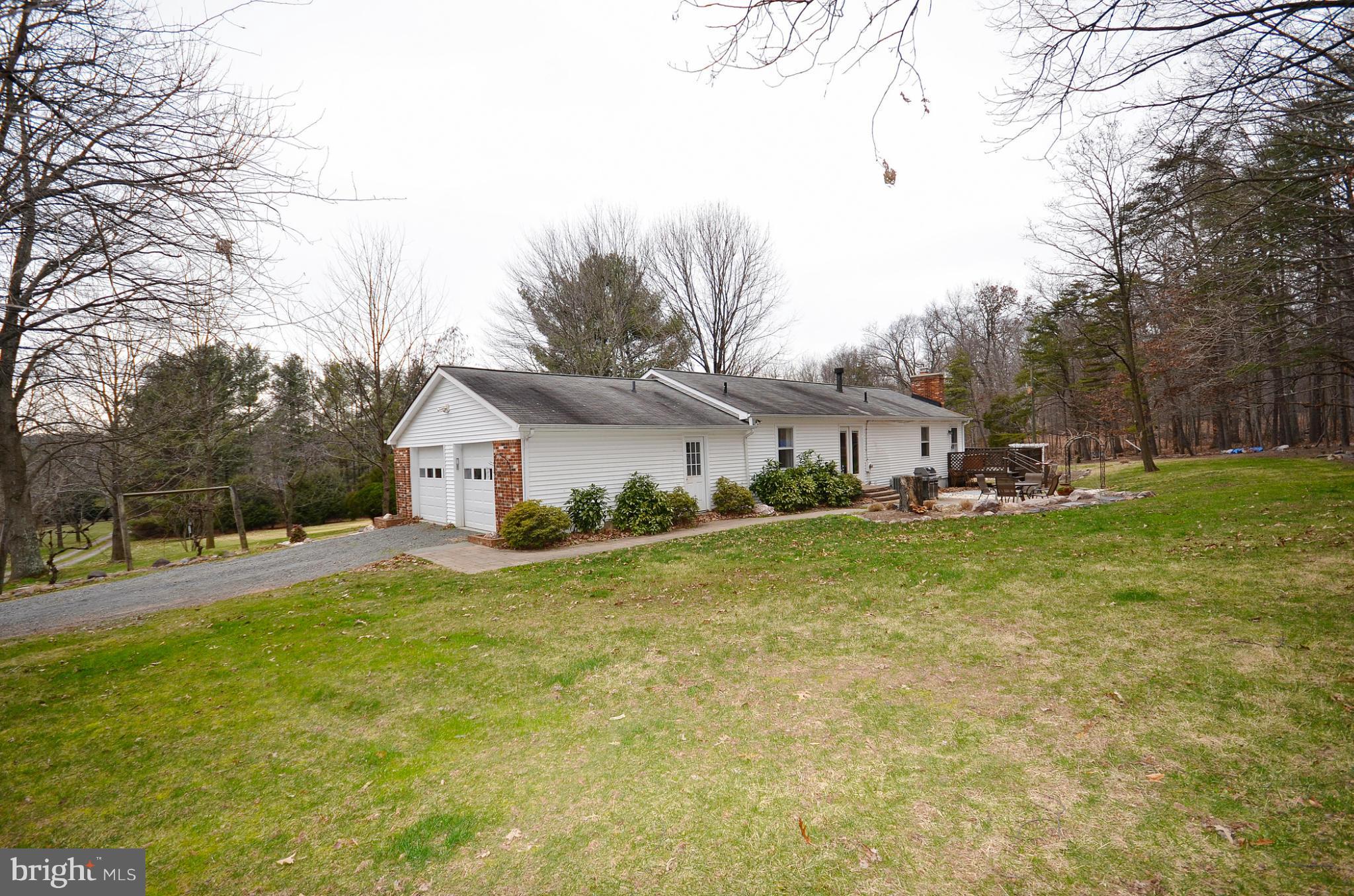 20952 Evergreen Mills Road Leesburg, VA 20175 - Photo 27 of 30 a view of a house with a yard