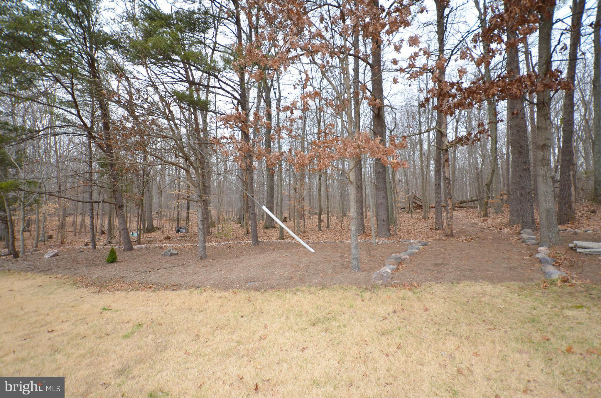 20952 Evergreen Mills Road Leesburg, VA 20175 - Photo 29 of 30 a backyard of a house with table and chairs