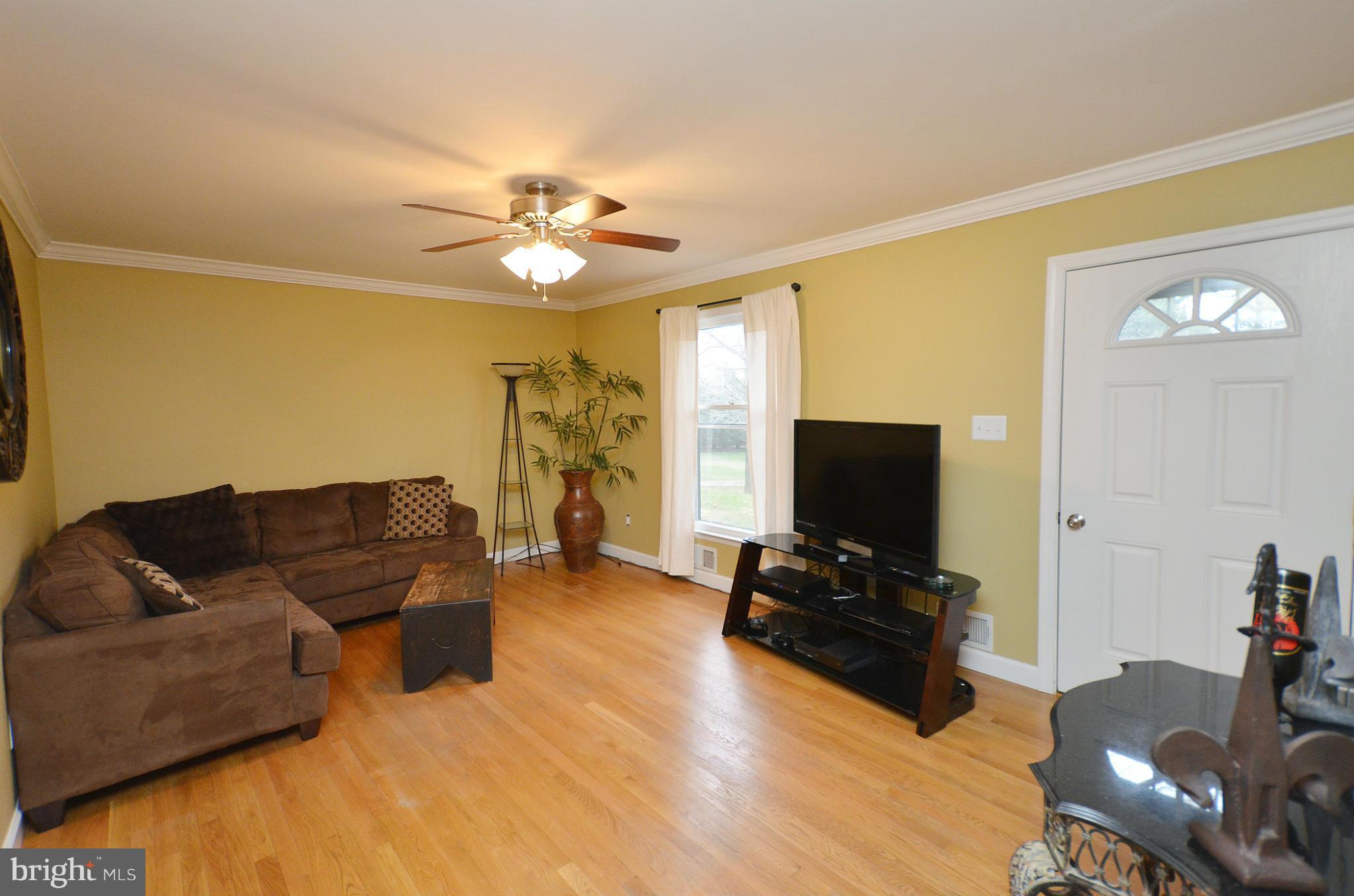 20952 Evergreen Mills Road Leesburg, VA 20175 - Photo 6 of 30 a living room with furniture and a flat screen tv