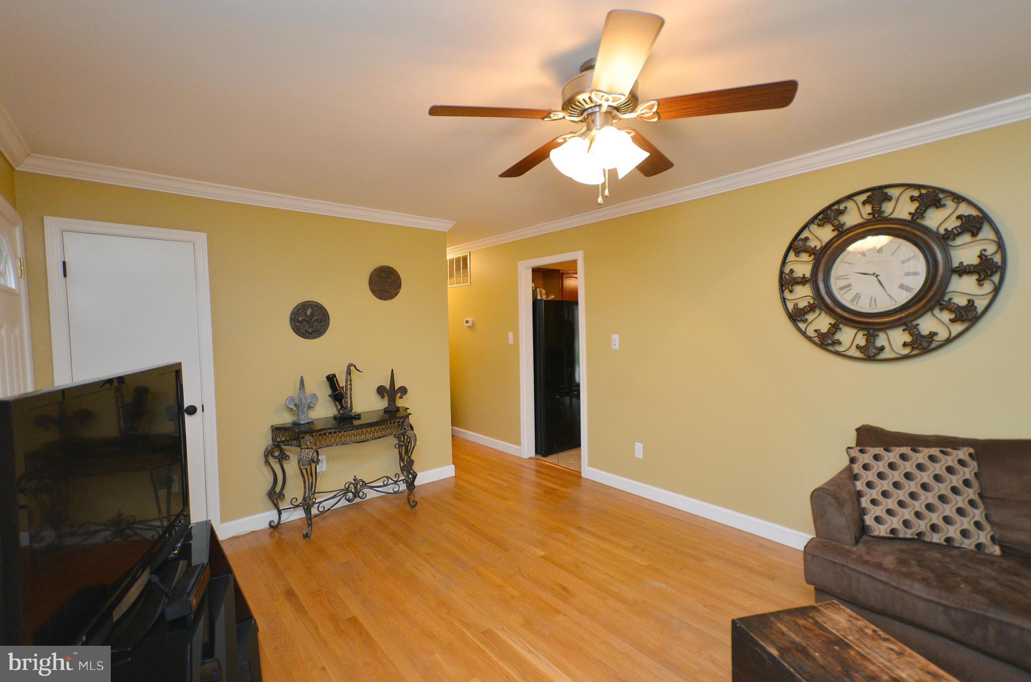 20952 Evergreen Mills Road Leesburg, VA 20175 - Photo 7 of 30 a bedroom with a bed and a chandelier