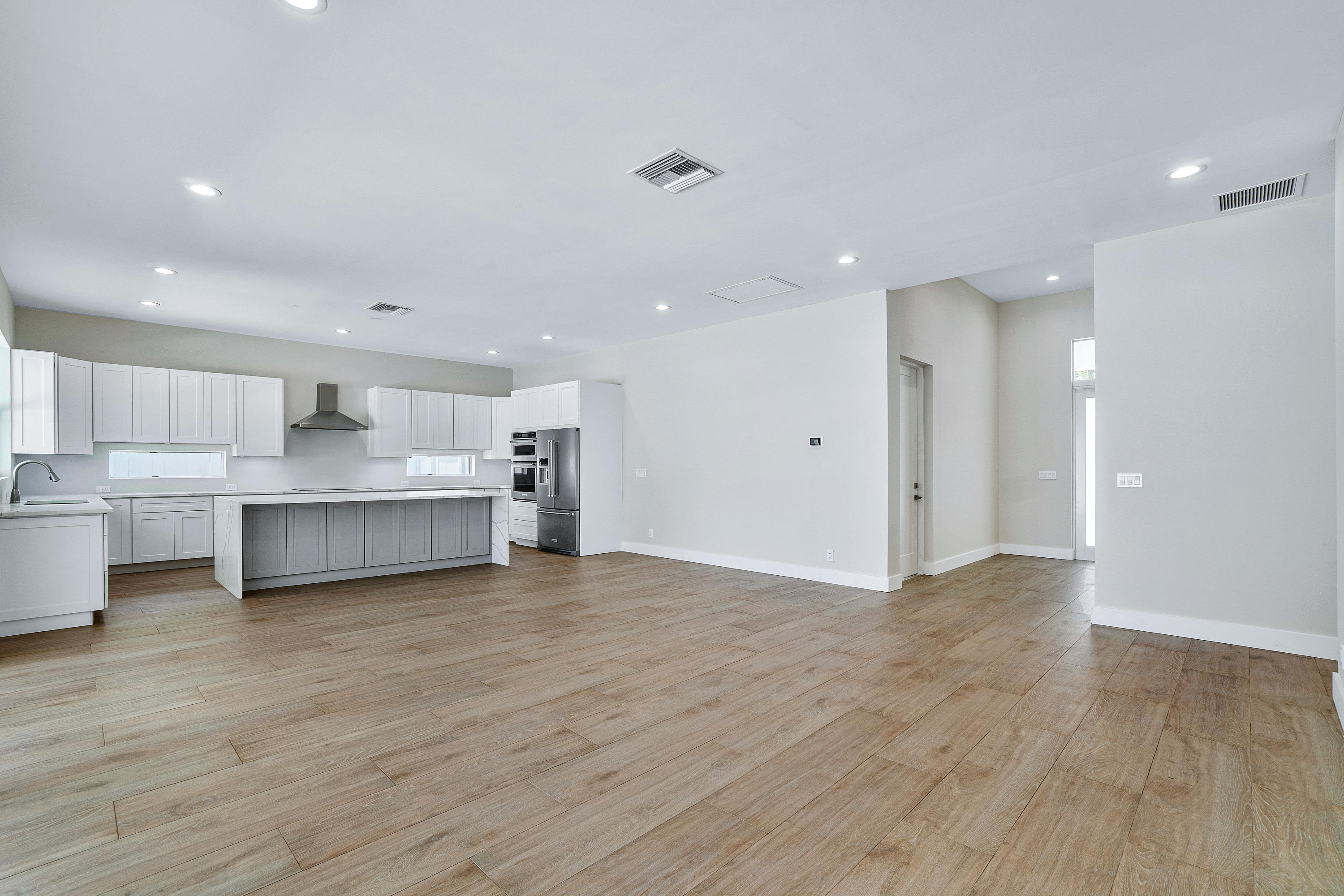 132 Southwest 7th Terrace Boca Raton, FL 33486 - Photo 10 of 39 a view of kitchen with wooden floor