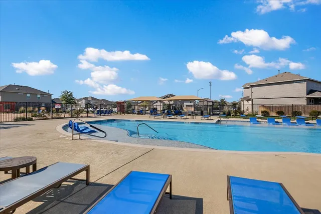 a room with lots of residential buildings and wooden floor