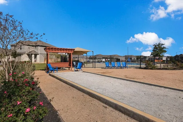 a view of multiple houses with a street