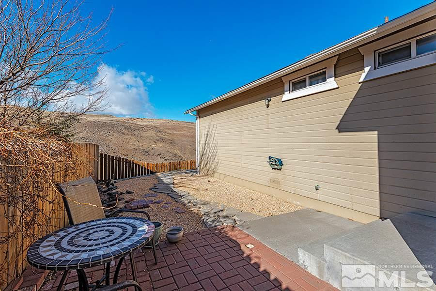 745 Talus Way Reno, NV 89503 - Photo 13 of 17 a backyard of a house with table and chairs