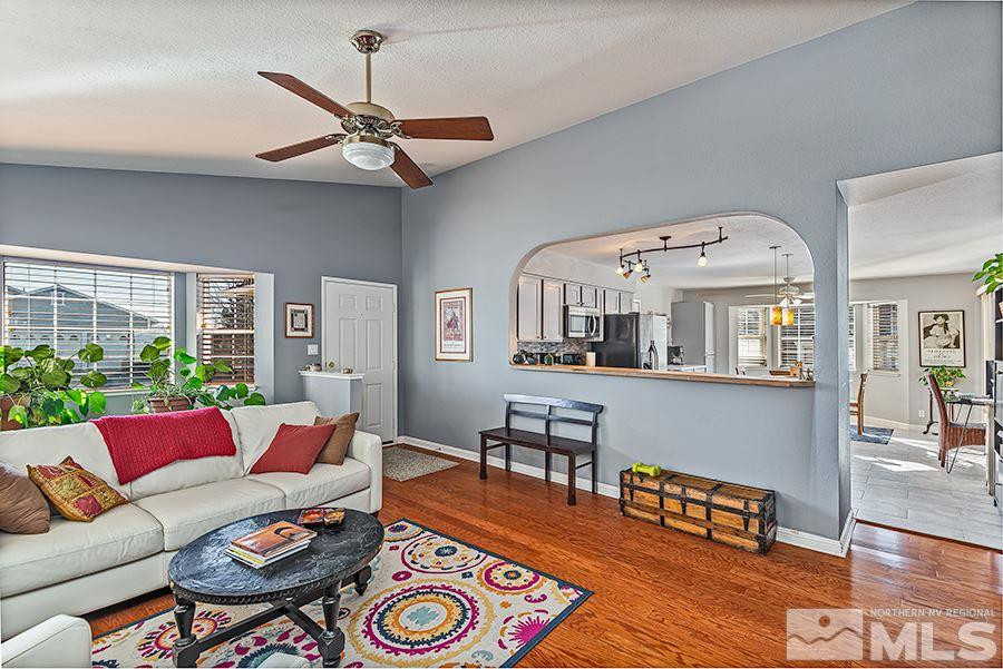 745 Talus Way Reno, NV 89503 - Photo 2 of 17 a living room with furniture and a large window