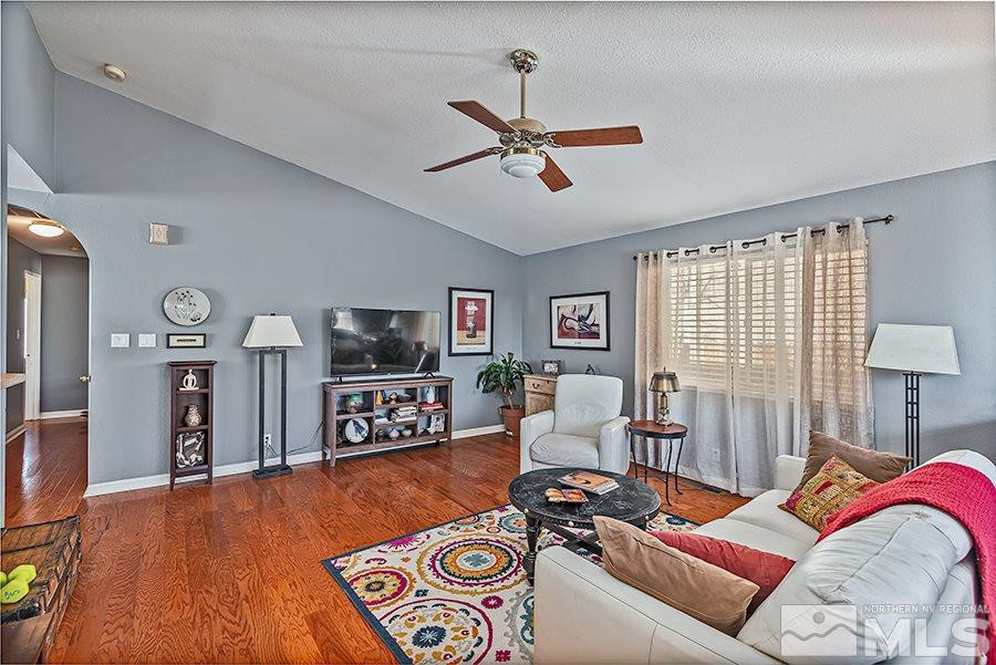 745 Talus Way Reno, NV 89503 - Photo 4 of 17 a living room with furniture and a flat screen tv
