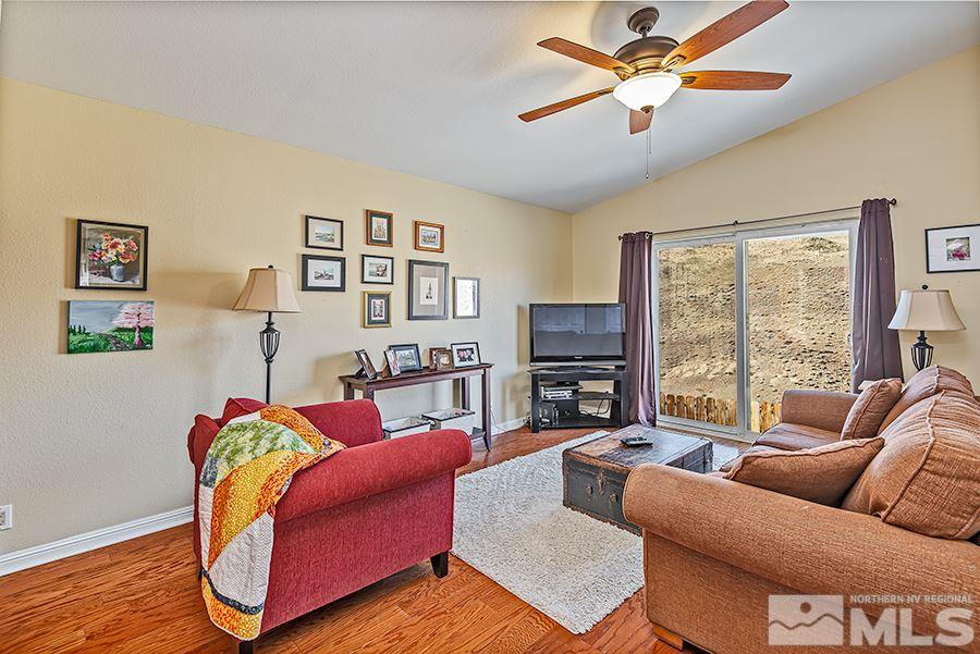 745 Talus Way Reno, NV 89503 - Photo 8 of 17 a living room with furniture and a large window