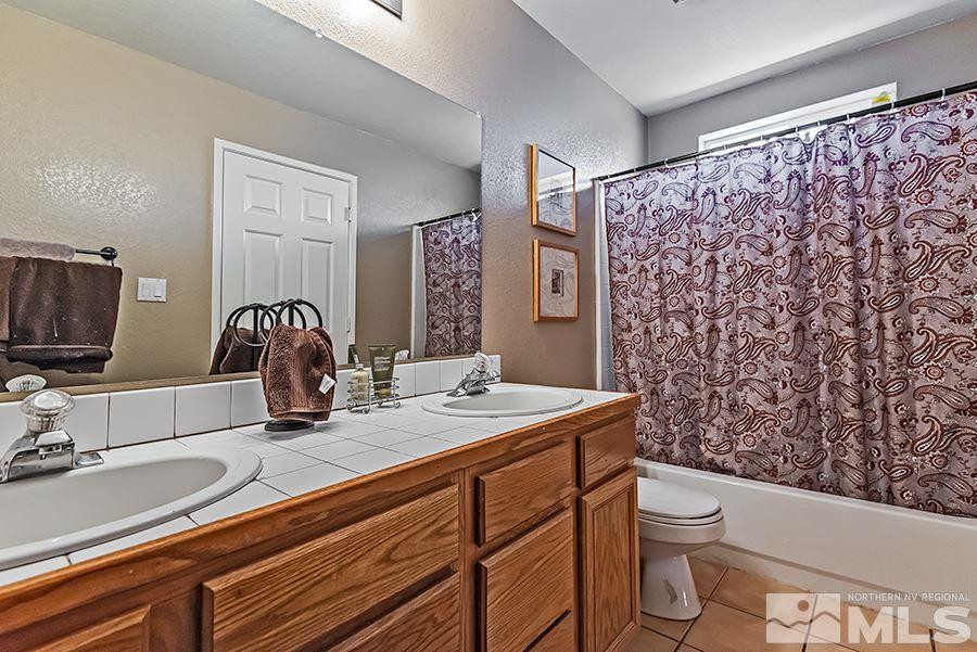 745 Talus Way Reno, NV 89503 - Photo 10 of 17 a bathroom with a sink toilet and shower