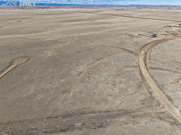 a view of a swimming pool and an outdoor space