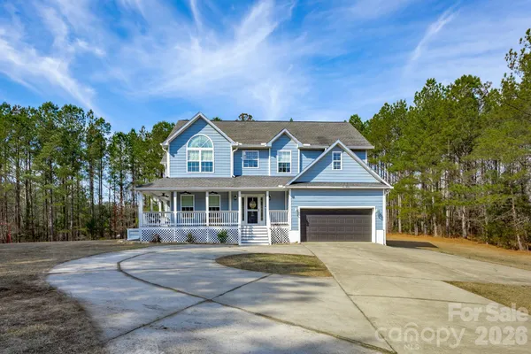front view of a house with a garden