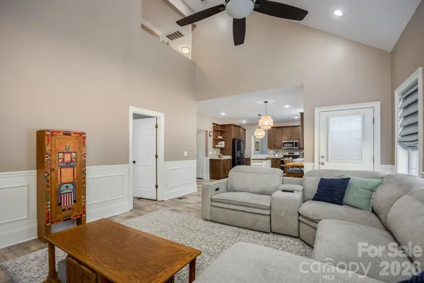 a living room with furniture and a table