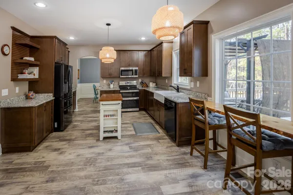 a large kitchen with lots of counter space and a sink