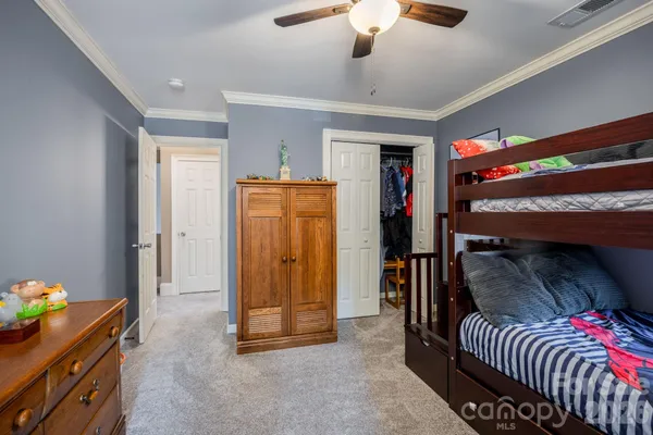 a bedroom with furniture and a window