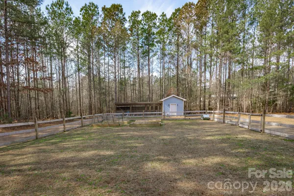a view of a house with a yard and garage