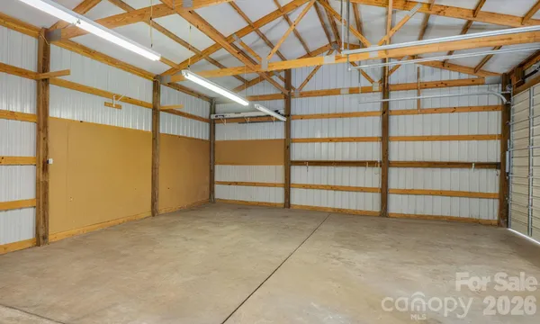 a view of a workspace with furniture and gym equipment