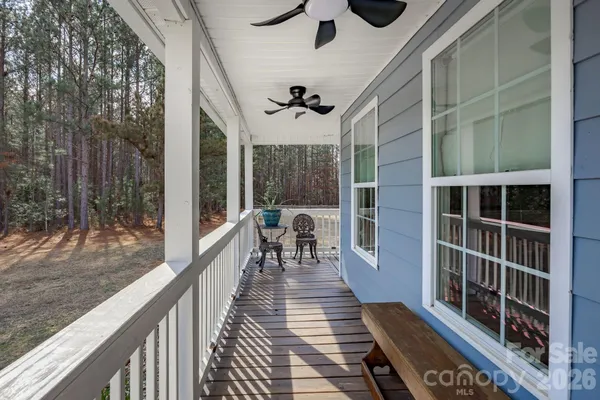 a view of a balcony with chairs